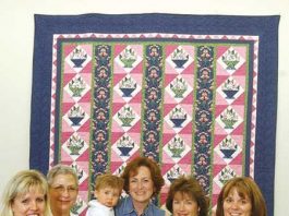 Basket of Hope quilt put to work at the Taste of MH