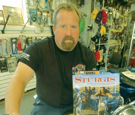 MH bike shop owner an unlikely cover boy