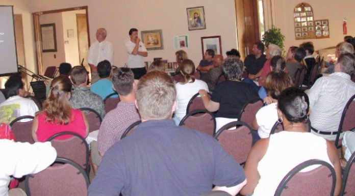 Neighbors unite to fight plans for new car dealership