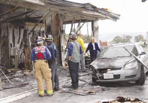 Arson Suspected in Robbery of Car Rental Business