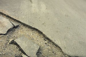 Red Phone: Trucks tear up road, city repairs potholes