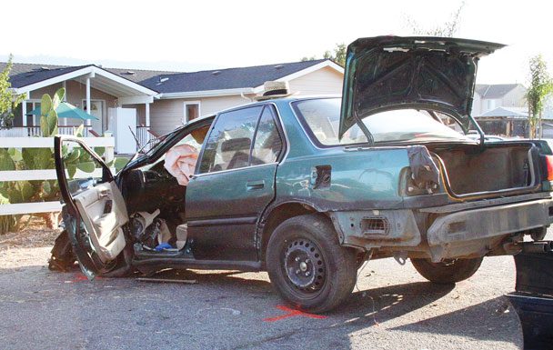 Driver, allegedly drunk and racing, rolls vehicle three times