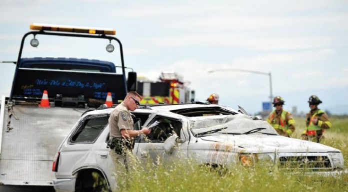 Woman suffers minor injuries in rollover accident