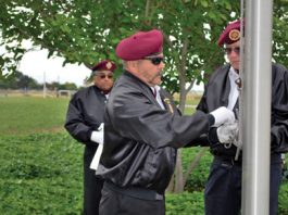 Veterans raise flag at Saint Louise