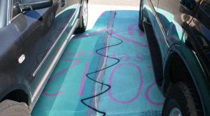 Christopher High School parking lot, buses tagged with profanity