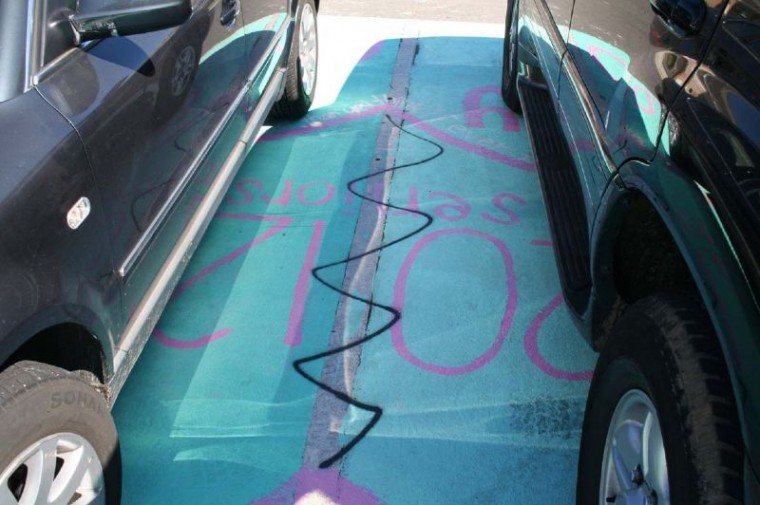 Christopher High School parking lot, buses tagged with profanity