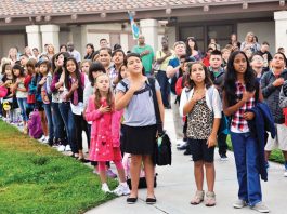 Parent complains of treatment toward child refusing to stand for Pledge