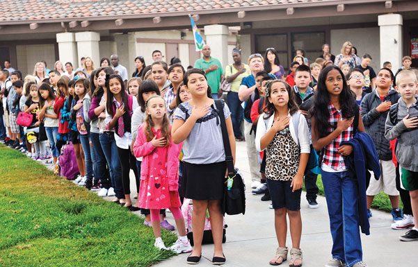 Parent complains of treatment toward child refusing to stand for Pledge