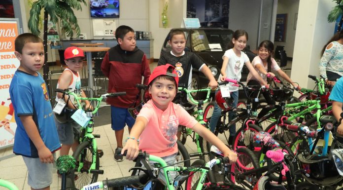 Honda of MH donates 38 bikes to needy kids