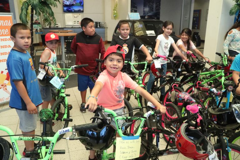 Honda of MH donates 38 bikes to needy kids