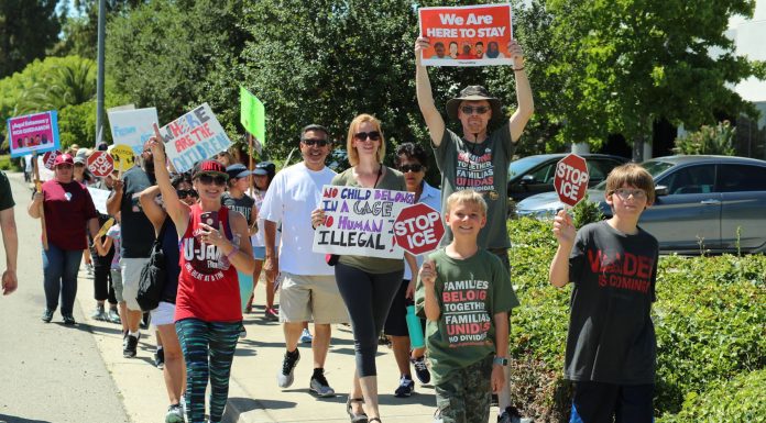 Locals partake in ‘Families Belong Together’ rally