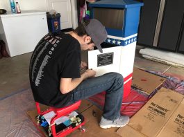 Local Scout completes Eagle project with flag collection boxes