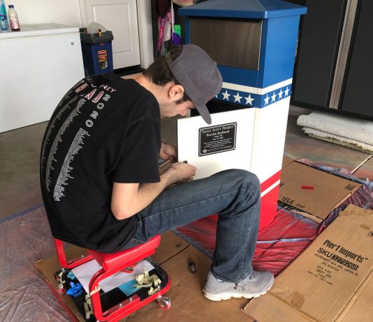 Local Scout completes Eagle project with flag collection boxes
