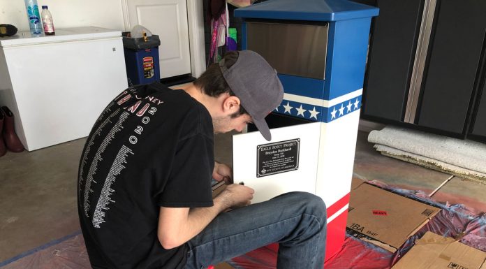 Local Scout completes Eagle project with flag collection boxes