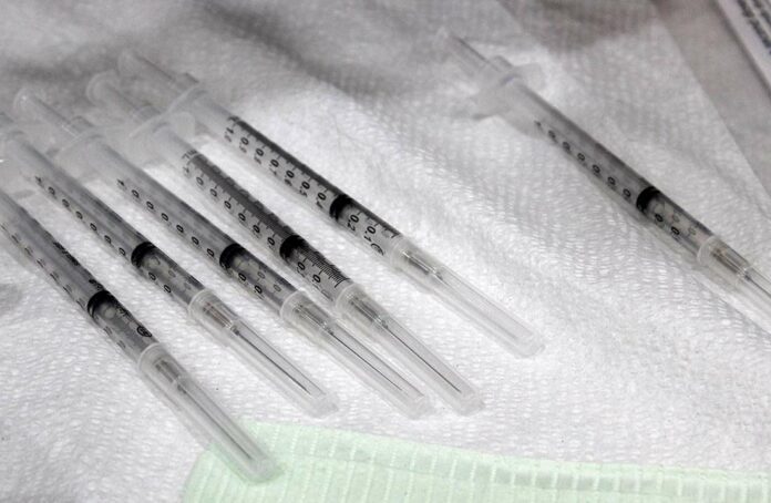 covid-19 vaccine syringe dose booster