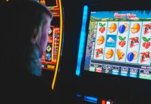 Local Players Face New Reality as State Cracks Down on Sweepstakes Machines Person using slot machine
