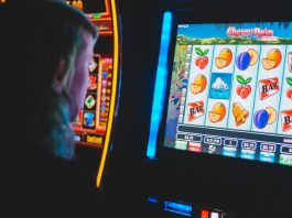Local Players Face New Reality as State Cracks Down on Sweepstakes Machines Person using slot machine
